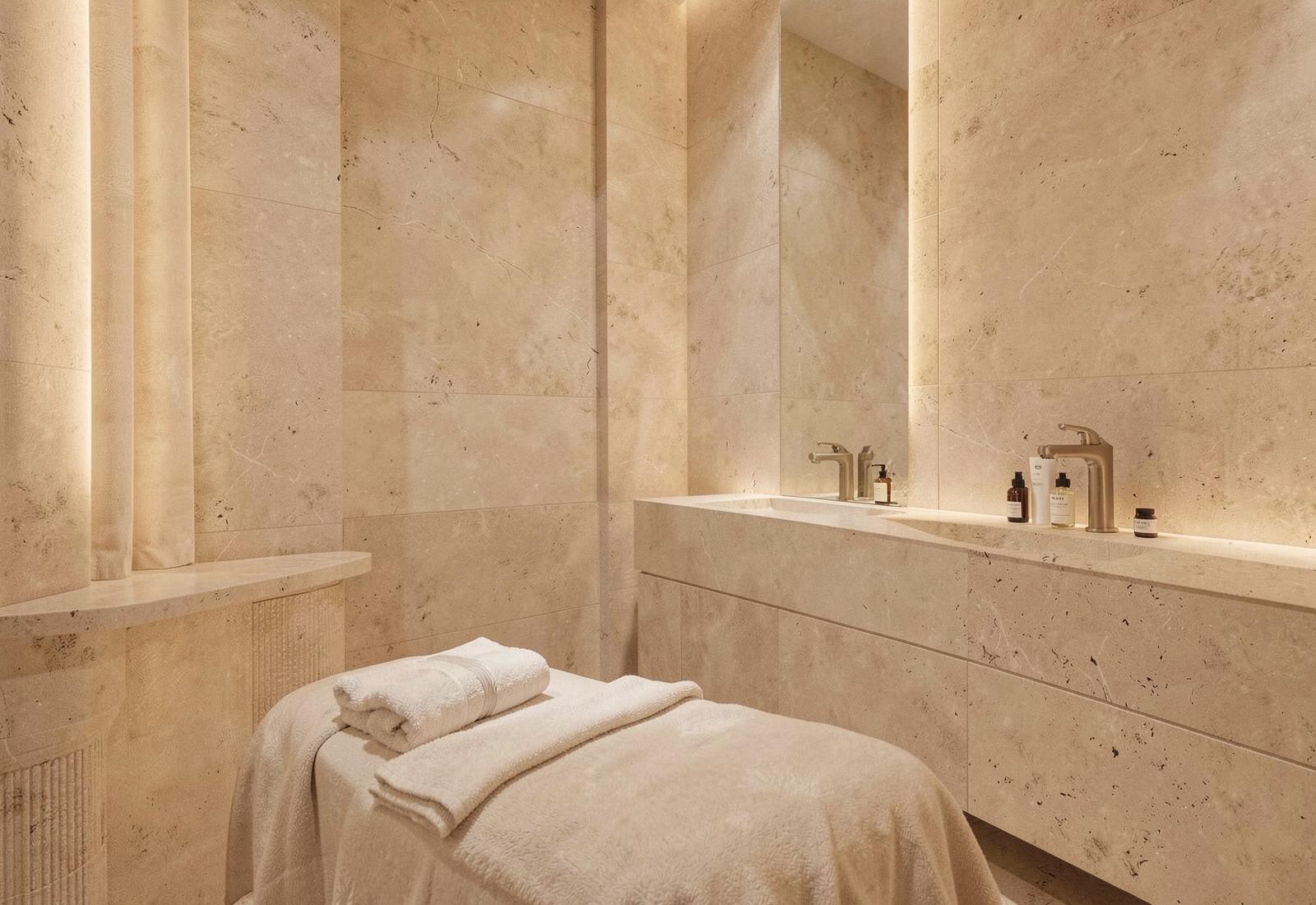 A calm, warmly lit private treatment room